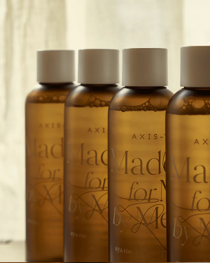 Four bottles of Axis-X Biome Comforting Infused Toner