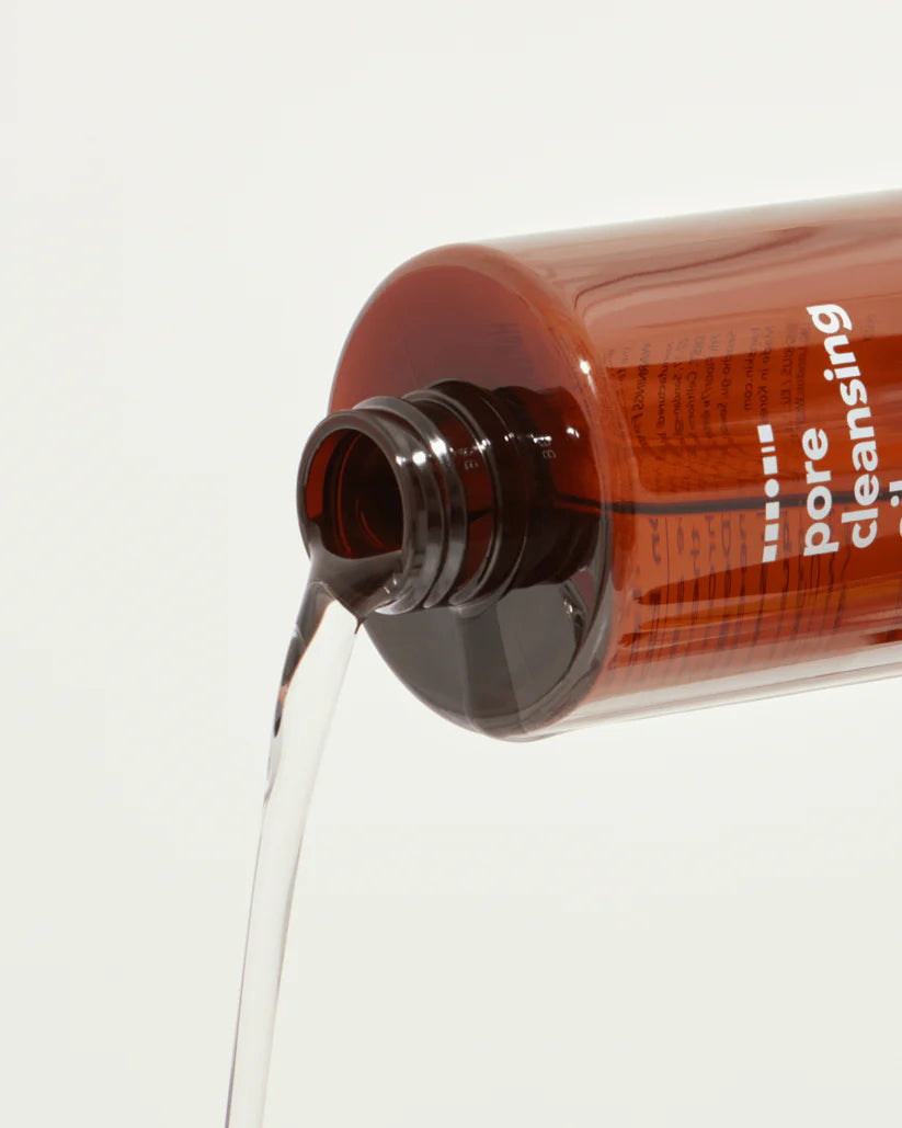 Bottle of Hanskin Pore Cleansing Oil [BHA] being poured