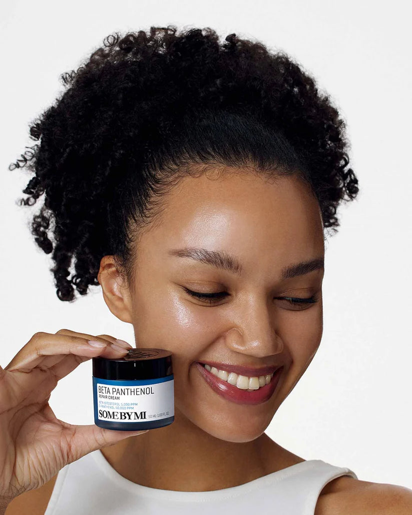 Woman holding SOME BY MI Beta Panthenol Repair Cream